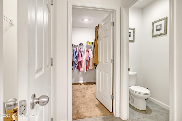 1005 Slocum St NW, Palm Bay, FL 32907 - bathroom featuring baseboards, toilet, and a spacious closet