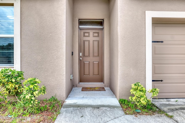 1005 Slocum St NW, Palm Bay, FL 32907 - doorway to property featuring stucco siding