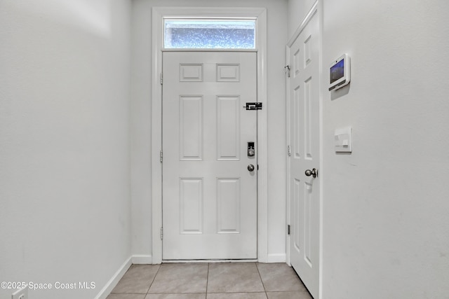 1005 Slocum St NW, Palm Bay, FL 32907 - foyer entrance with baseboards and light tile patterned floors