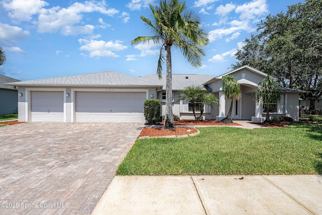 1555 Knoll Ridge Dr, Melbourne, FL 32940 - ranch-style house with stucco siding, driveway, a garage, and a front lawn