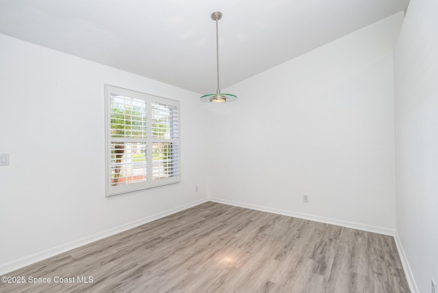 1555 Knoll Ridge Dr, Melbourne, FL 32940 - spare room with light wood-style flooring, baseboards, and lofted ceiling