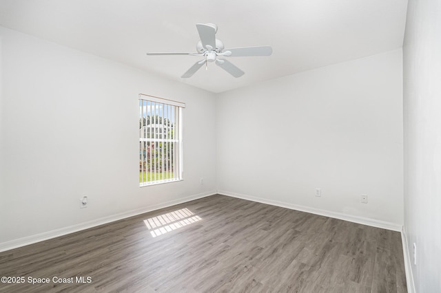 1555 Knoll Ridge Dr, Melbourne, FL 32940 - spare room with wood finished floors, a ceiling fan, and baseboards