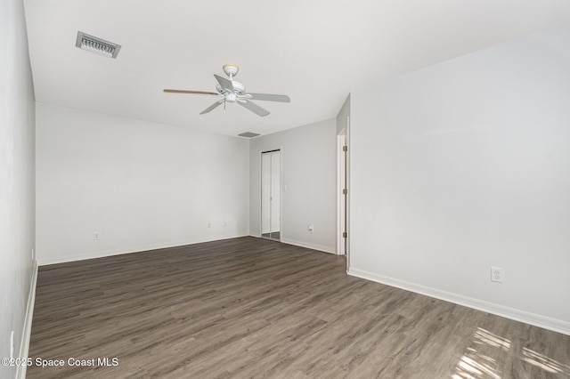 1555 Knoll Ridge Dr, Melbourne, FL 32940 - unfurnished room with wood finished floors, ceiling fan, and baseboards