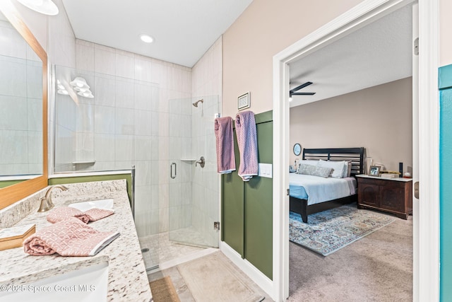 1641 Earlham Ave NW, Palm Bay, FL 32907 - full bathroom with a shower stall, vanity, connected bathroom, and a ceiling fan