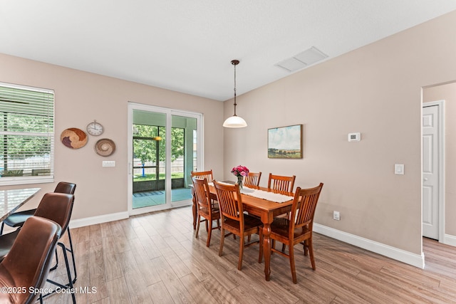 1641 Earlham Ave NW, Palm Bay, FL 32907 - dining space with light wood-style flooring and baseboards