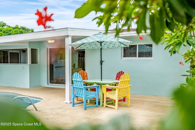 475 Park Ave, Satellite Beach, FL 32937 - view of patio featuring an outdoor pool and outdoor dining area