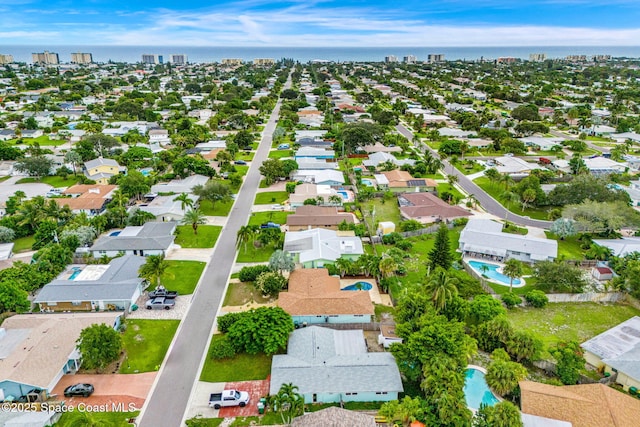 475 Park Ave, Satellite Beach, FL 32937 - aerial view of residential area featuring a pool and a large body of water