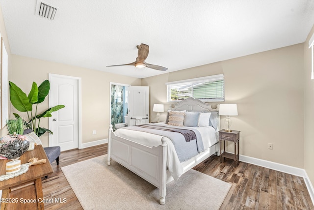 475 Park Ave, Satellite Beach, FL 32937 - bedroom with baseboards, wood finished floors, and a ceiling fan