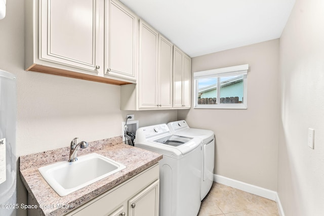 475 Park Ave, Satellite Beach, FL 32937 - laundry area with washer and dryer, cabinet space, baseboards, light tile patterned floors, and water heater