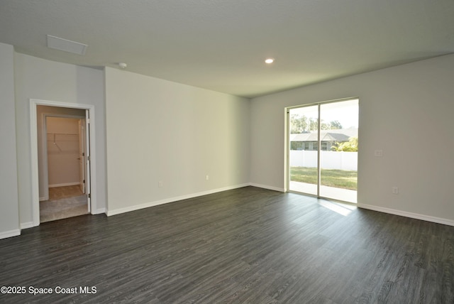 883 Parrotfish St SW, Palm Bay, FL 32908 - empty room featuring dark wood-type flooring, baseboards, and recessed lighting