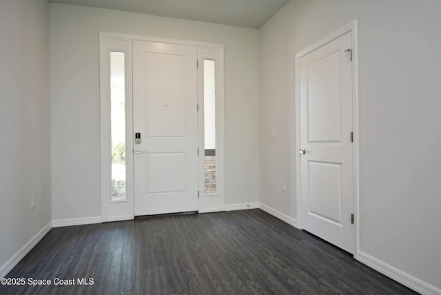 883 Parrotfish St SW, Palm Bay, FL 32908 - foyer with dark wood-style floors and baseboards