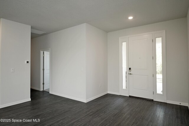883 Parrotfish St SW, Palm Bay, FL 32908 - foyer with dark wood-style flooring, baseboards, and recessed lighting