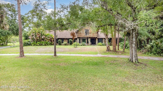 4121 Mustang Rd, Melbourne, FL 32934 - view of front facade with a front lawn