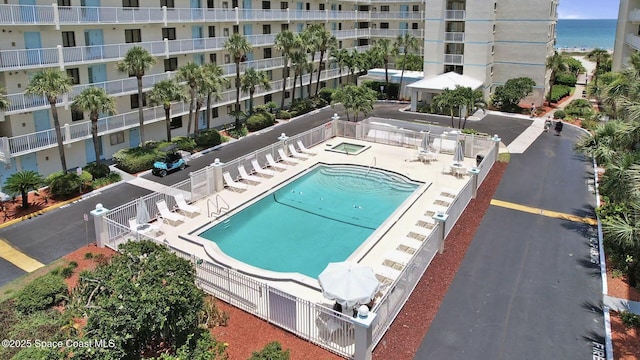 1000 N Atlantic Ave Unit 614, Cocoa Beach, FL 32931 - community pool with a water view and a patio area