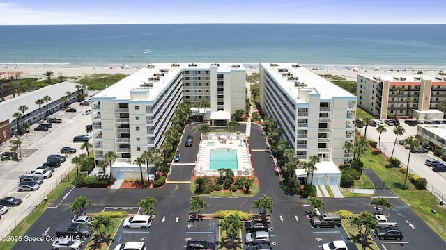 1000 N Atlantic Ave Unit 614, Cocoa Beach, FL 32931 - drone / aerial view of apartment complex and waterfront with a beach