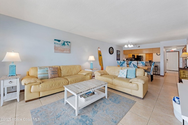 1000 N Atlantic Ave Unit 614, Cocoa Beach, FL 32931 - living area with a chandelier, light tile patterned floors, and a textured ceiling