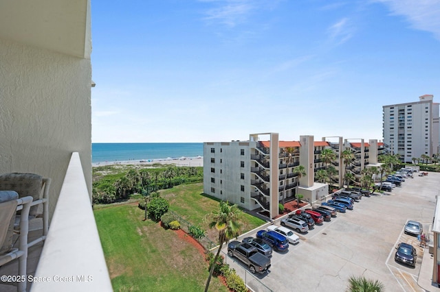 1000 N Atlantic Ave Unit 614, Cocoa Beach, FL 32931 - view of apartment building / complex featuring uncovered parking and a water view