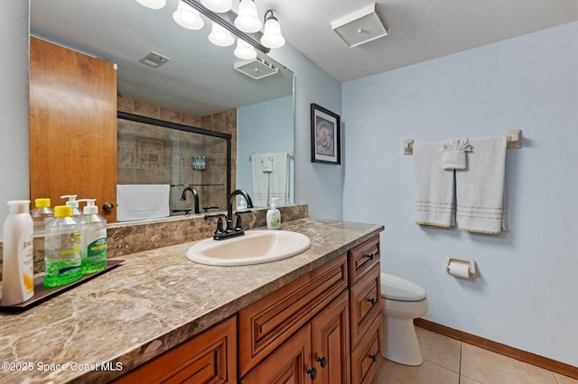 1000 N Atlantic Ave Unit 614, Cocoa Beach, FL 32931 - full bathroom with toilet, vanity, tile patterned flooring, tiled shower, and baseboards