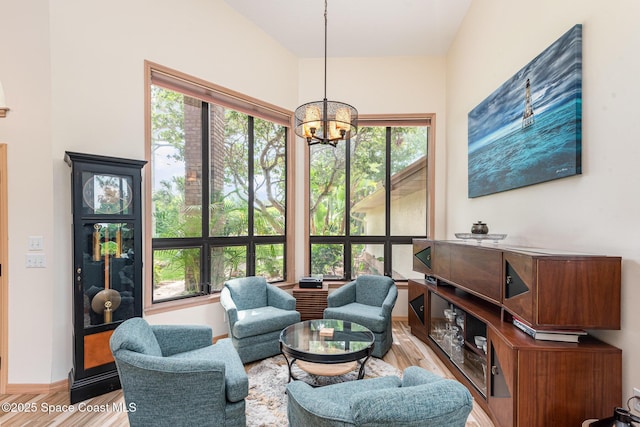 3750 Shady Run Rd, Melbourne, FL 32934 - living area featuring a chandelier, light wood-style flooring, and healthy amount of natural light
