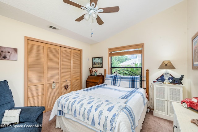 3750 Shady Run Rd, Melbourne, FL 32934 - bedroom with light colored carpet, vaulted ceiling, a closet, and a ceiling fan