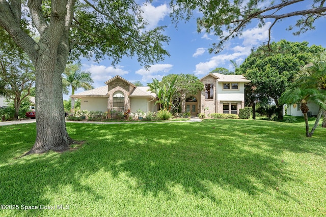 3750 Shady Run Rd, Melbourne, FL 32934 - view of front of home with stucco siding and a front yard
