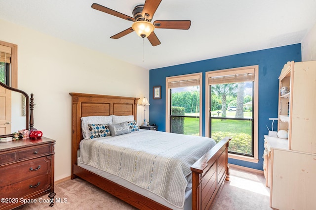 3750 Shady Run Rd, Melbourne, FL 32934 - bedroom with light carpet, a ceiling fan, and baseboards