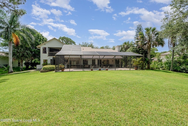 3750 Shady Run Rd, Melbourne, FL 32934 - rear view of property featuring a lawn, a lanai, and a chimney