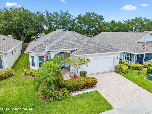 638 Brockton Way W, Melbourne, FL 32904 - view of front of property with a garage, roof with shingles, decorative driveway, and a front yard