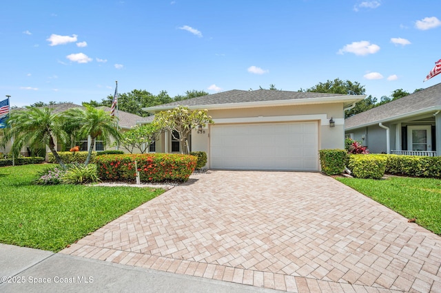 638 Brockton Way W, Melbourne, FL 32904 - single story home featuring decorative driveway, stucco siding, an attached garage, and a front lawn