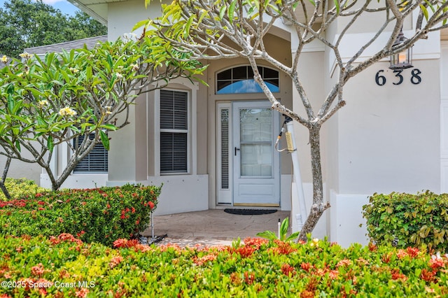 638 Brockton Way W, Melbourne, FL 32904 - property entrance featuring stucco siding