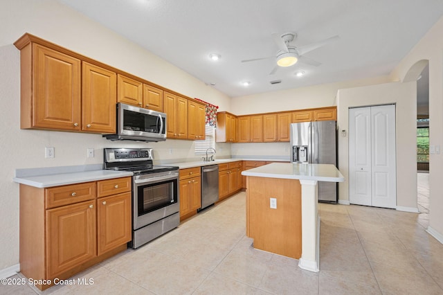 638 Brockton Way W, Melbourne, FL 32904 - kitchen with appliances with stainless steel finishes, arched walkways, healthy amount of natural light, and a ceiling fan
