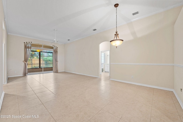 638 Brockton Way W, Melbourne, FL 32904 - empty room with ornamental molding, arched walkways, light tile patterned floors, baseboards, and a ceiling fan