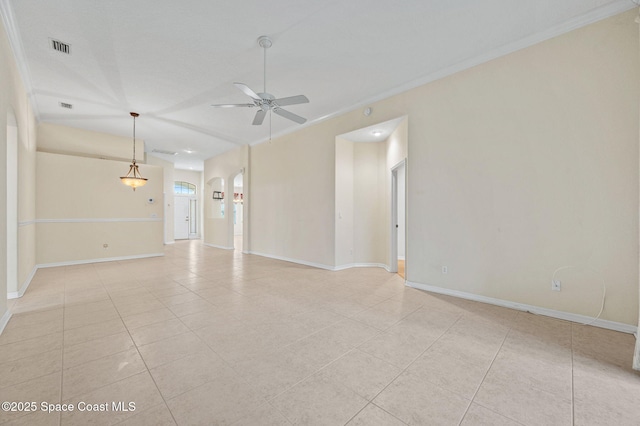 638 Brockton Way W, Melbourne, FL 32904 - spare room featuring light tile patterned floors, a ceiling fan, crown molding, baseboards, and arched walkways