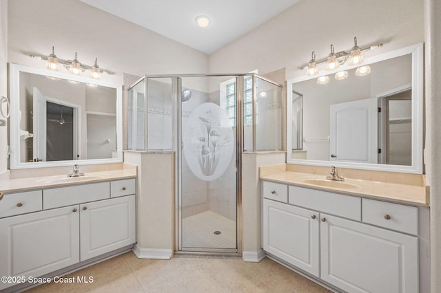 638 Brockton Way W, Melbourne, FL 32904 - full bathroom featuring a stall shower, two vanities, tile patterned floors, and baseboards