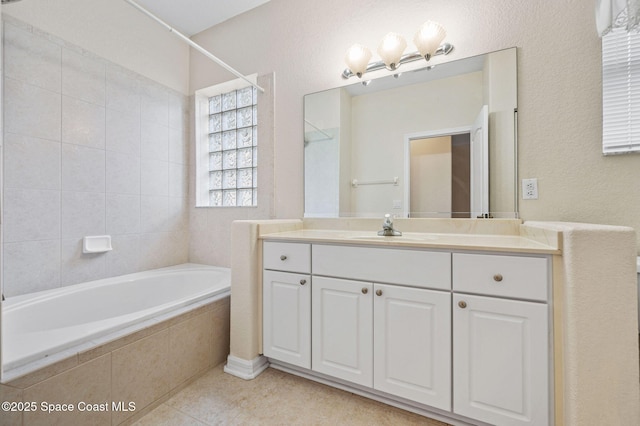 638 Brockton Way W, Melbourne, FL 32904 - bathroom featuring vanity, tile patterned flooring, and tiled shower / bath