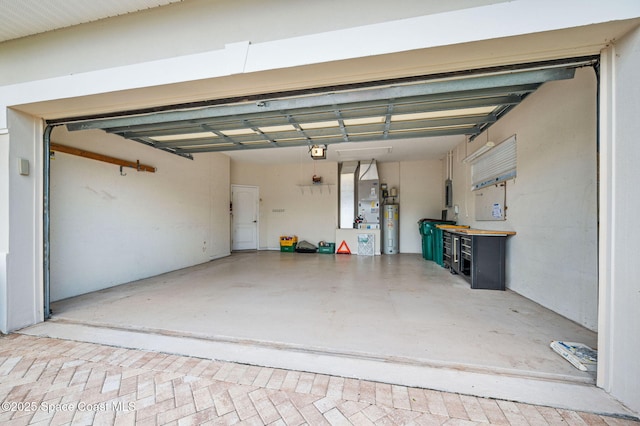 638 Brockton Way W, Melbourne, FL 32904 - garage featuring electric water heater and a garage door opener