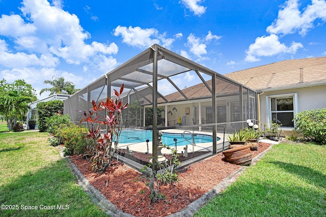 1068 Egret Lake Way, Melbourne, FL 32940 - outdoor pool featuring a yard, glass enclosure, and a patio area