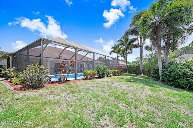 1068 Egret Lake Way, Melbourne, FL 32940 - view of grassy yard featuring an outdoor pool and a lanai