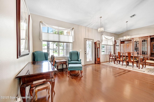 1068 Egret Lake Way, Melbourne, FL 32940 - living area with a chandelier and wood finished floors