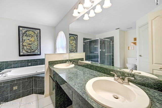 1068 Egret Lake Way, Melbourne, FL 32940 - full bath with toilet, a bath, a stall shower, double vanity, and tile patterned floors