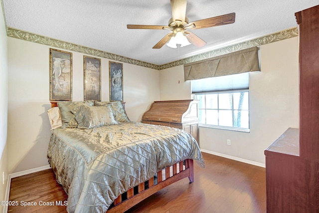1068 Egret Lake Way, Melbourne, FL 32940 - bedroom with baseboards, a textured ceiling, wood finished floors, and ceiling fan