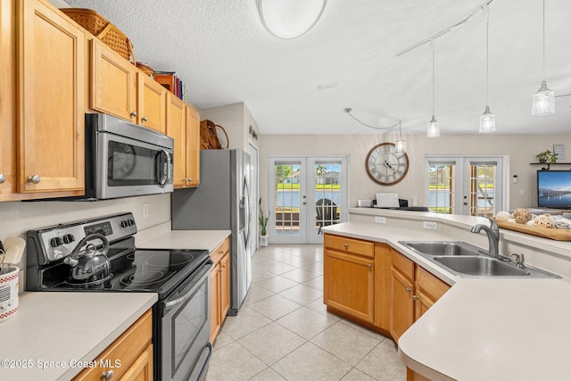 1223 Brumpton Pl, Rockledge, FL 32955 - kitchen featuring french doors, appliances with stainless steel finishes, a sink, light countertops, and plenty of natural light