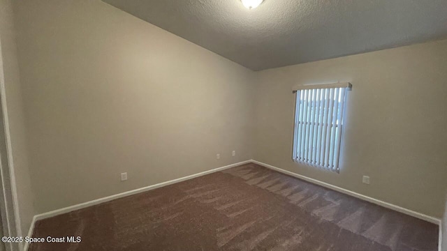 975 Luminary Cir Unit 103, Melbourne, FL 32901 - carpeted empty room with baseboards and a textured ceiling