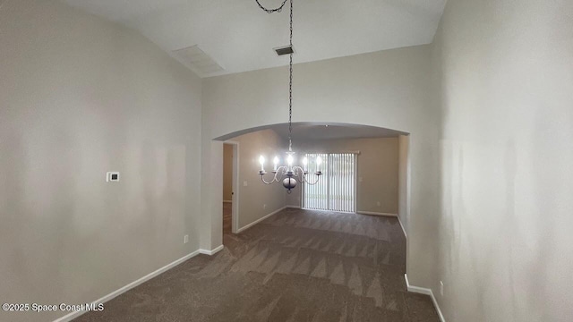 975 Luminary Cir Unit 103, Melbourne, FL 32901 - hallway with arched walkways, a chandelier, carpet, baseboards, and high vaulted ceiling