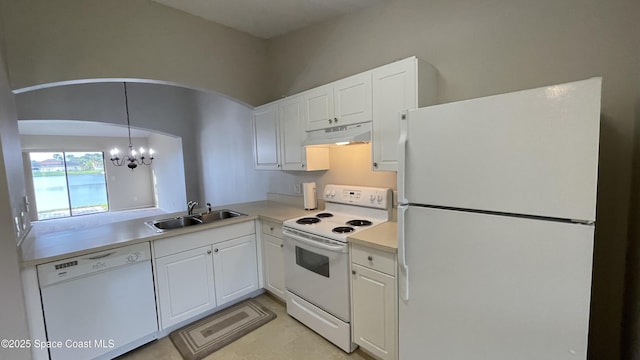 975 Luminary Cir Unit 103, Melbourne, FL 32901 - kitchen featuring white appliances, a sink, a chandelier, under cabinet range hood, and light countertops