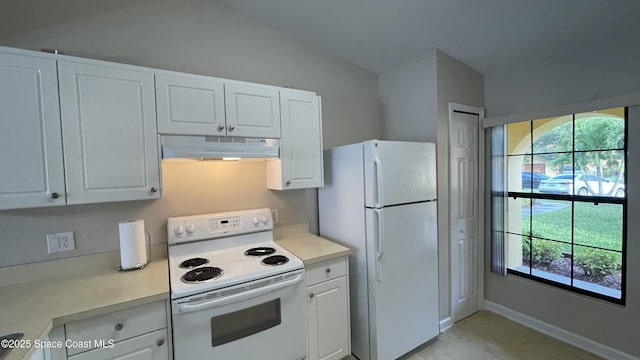 975 Luminary Cir Unit 103, Melbourne, FL 32901 - kitchen with under cabinet range hood, white appliances, light countertops, lofted ceiling, and white cabinets