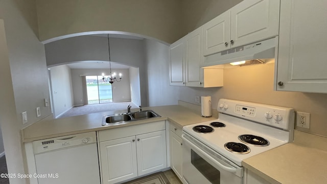 975 Luminary Cir Unit 103, Melbourne, FL 32901 - kitchen with white appliances, under cabinet range hood, a sink, arched walkways, and a chandelier
