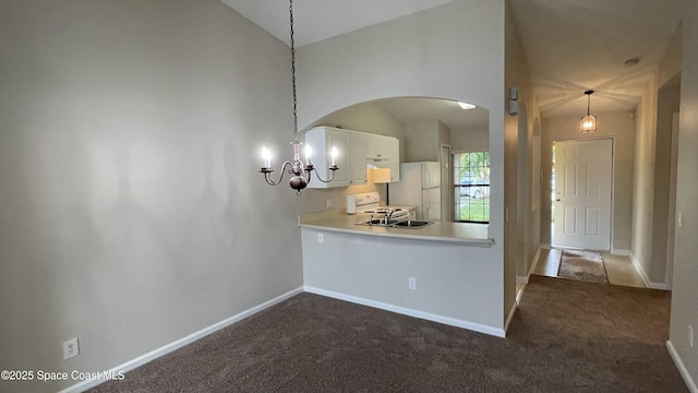 975 Luminary Cir Unit 103, Melbourne, FL 32901 - dining space with arched walkways, a chandelier, dark colored carpet, lofted ceiling, and baseboards