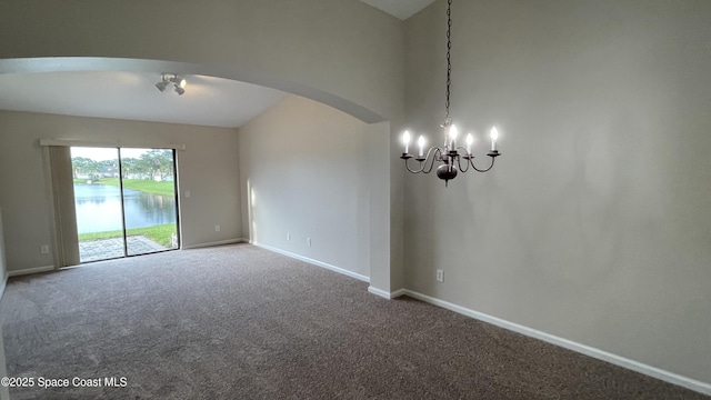 975 Luminary Cir Unit 103, Melbourne, FL 32901 - carpeted spare room with arched walkways, a chandelier, baseboards, and a water view