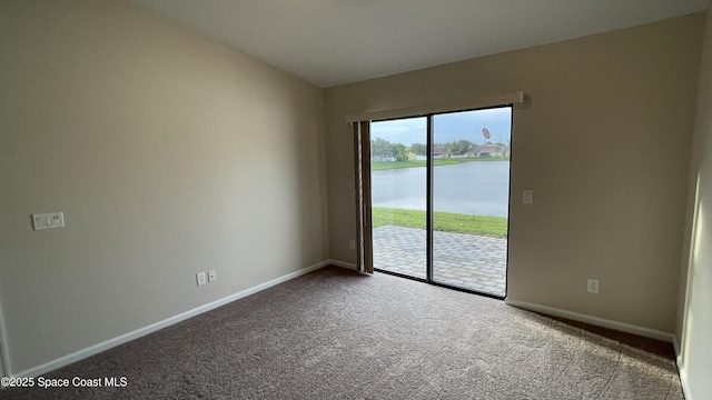 975 Luminary Cir Unit 103, Melbourne, FL 32901 - carpeted spare room with baseboards and a water view